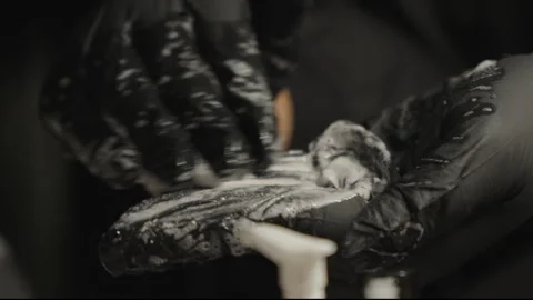 Close Up of Hands in Black Nitrile Gloves Lathering Soap Suds 스톡 동영상 345099660