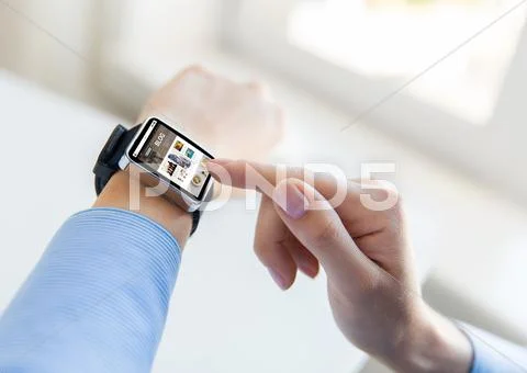 Close up of hands with blog on smart watch screen Stock Photos