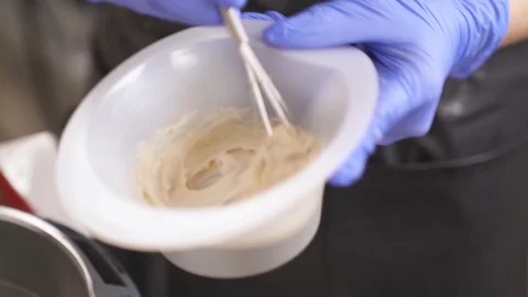 A close up of hands in blue rubber gloves holding a bowl  Stock Footage 96068076
