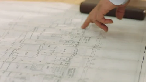 Close-up of hands on blueprint when business team discussing in meeting Stock Footage 123789218