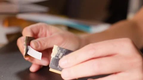 Close Up of Hands Breaking a Computer Memory RAM Circuit Board Stock Footage 327249232