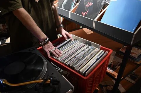 Close-Up of Hands Browsing Vinyl Records with Bracelets Stock Photos