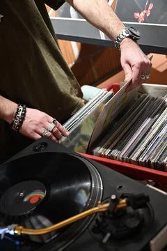 Close-Up of Hands Browsing Vinyl Records with Bracelets Stock Photos