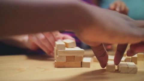 Close up of hands building jenga tower Stock Footage 106986991