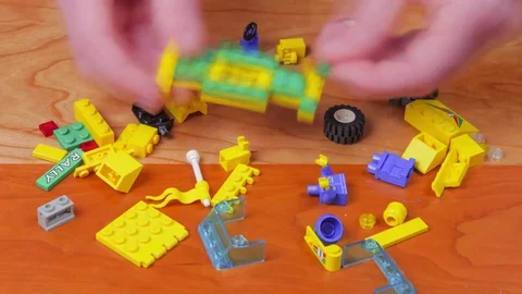 Close Up Hands Building Toy Brick Truck Stock Footage 81220760