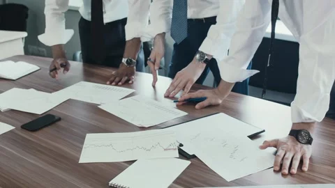Close-up of hands of businessmen, papers with graphs forex. Stock Footage 92738984