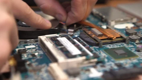 Close-up of hands, changing the fan, cooler in the laptop. Stock Footage 120016054