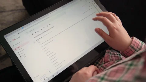 Close up of hands checking mail and typing on touchscreen Stock Footage 128319332