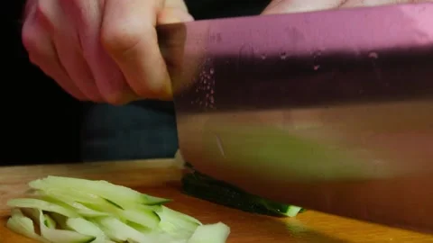 Close up hands of chef cook cutting avocado in slow motion in a dark kitchen Video stock 153206573