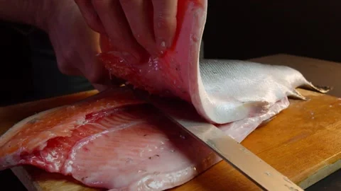 Close up hands of chef cook cutting cucumber in slow motion in a dark kitchen Video stock 153206920