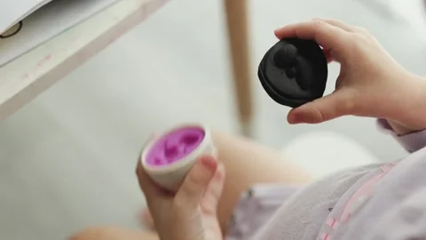 Close-up hands of child play with modeling clay on white background. Toddler Stock Footage 311170188