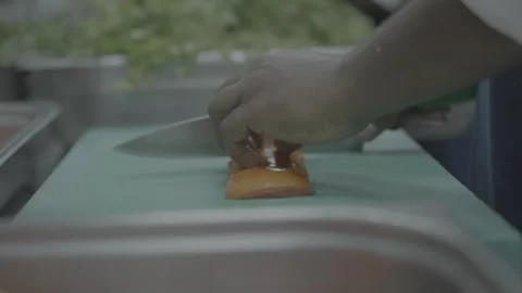 Close up of hands chopping fresh vegetables in commercial kitchen Stock-Footage 325701485