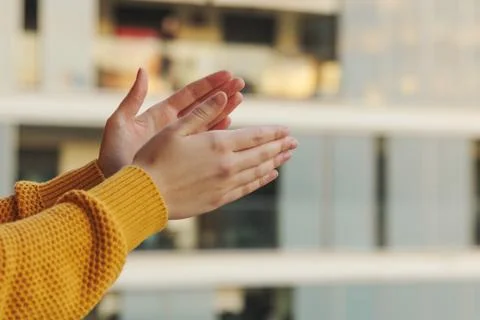 A close-up of hands clapping from the balcony in support of the medical team Stock-Fotos