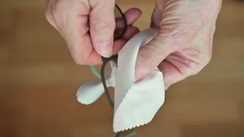 Close-Up Of Hands Cleaning Glasses With Soft Cloth And Black Frame Stock Footage 327957316