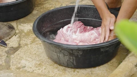 Close Up of Hands Cleaning Raw Pork Belly in a Basin Before Grilling Stock Footage 342030565