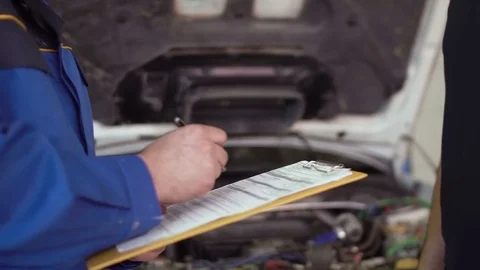 Close up of hands client of repair car service is giving keys to car mechanic Video stock 74607754