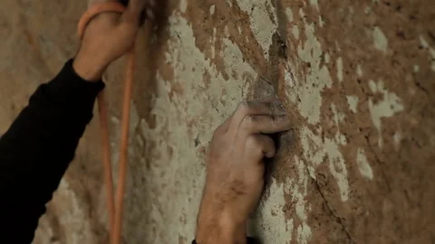 Close-up of the hands of a climber climbing the wall and making insurance. Stock Footage 121923679
