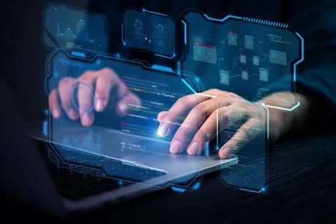 Close-up of hands coding programmer works on a laptop with futuristic cyber.. Stock Photos