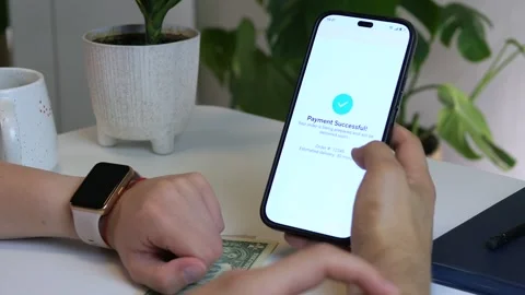 Close-up of hands completing food order payment with phone confirmation and cash Stock-Footage 314890822