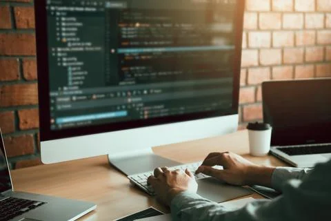 Close up of hands contemporary website developer man typing and writing cod.. Stock Photos