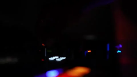 Close-up of hands controlling DJ mixer faders during a vibrant club party c.. Video stock 331789668