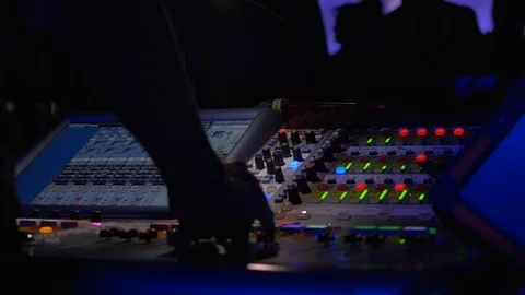 Close-up of  hands controlling sound board at live performance. Stock Footage 109144717