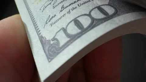 Close-up of hands counting 100 US dollar bills. 4K video. Stock Footage 263700253