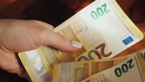 Close up of hands counting 200 euro bills. Paying with European banknotes. Stock Footage 308529572
