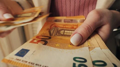 Close-up of hands, counting 50 euro notes. Payment in European banknotes. Person Stock Footage 308530215