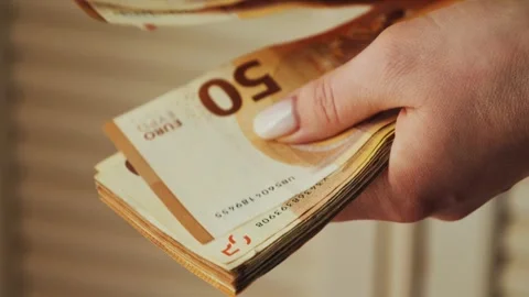 Close-up of hands counting 50-euro bills. Paying with European bills. Stock Footage 318747564