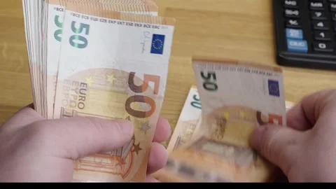 Close up of hands counting 50 Euro banknotes on office desk Stock Footage 336206428
