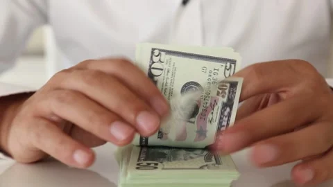Close Up of Hands Counting Dollar Bills Stock Footage 340902288