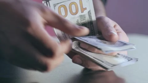 Close-up of hands counting dollars Video stock 284444132
