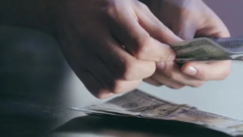 Close-up of hands counting dollars Stock Footage 284444137