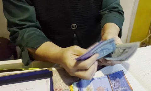 Close Up of Hands Counting Malaysian Ringgit Banknotes Stock Footage 327770621