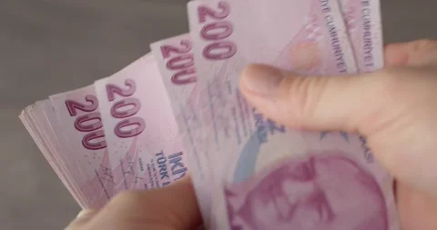 Close-up of hands counting new Turkish lira paper banknotes. Hands hold Stock Footage 222452239