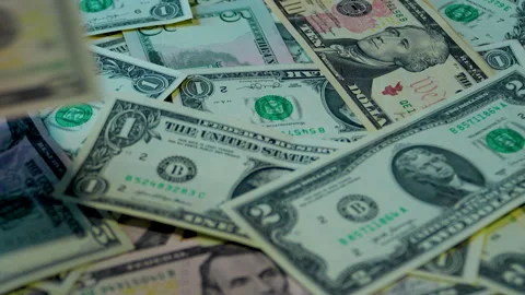 Close Up Of Hands Counting Scattered US Dollar Bills On Table Stock Footage 339988787