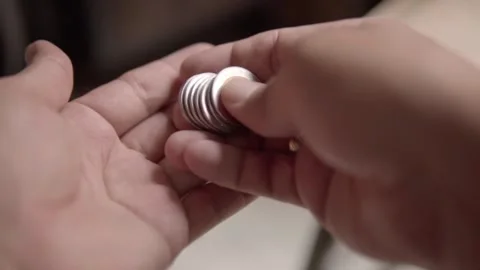 Close up of hands counting stacked Mexican coins for cash payment and financial Stock Footage 343805941