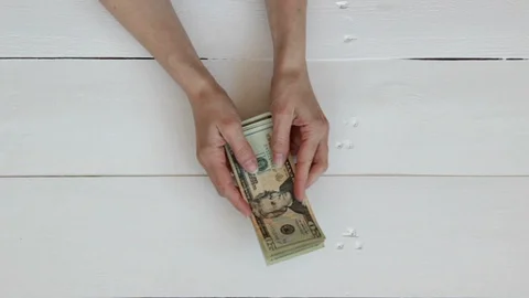 Close-Up Of A Hands counts the dollar bills and take them away Stock Footage 129293734