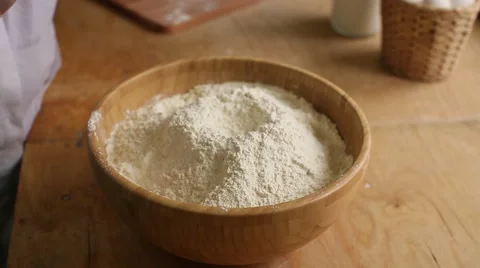 Close up of hands cracking an egg on a bowl Stock Footage 64946494