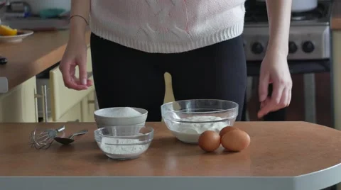 Close up of hands cracking an egg on a bowl and pouring it in, close up Stock Footage 67807753
