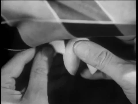 Close-up of hands cracking open fortune cookie Stock Footage 260251149