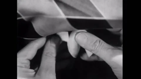 Close-up of hands cracking open fortune cookie - Closeup of hands cracking .. Stock Footage 260256929