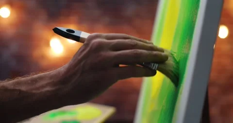 Close Up Hands of Creative Artist is drawing painting, using Paint Brush. Stock Footage 141582164