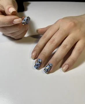 Close-Up of Hands with Creative Patterned Nail Art and Nude Accents Stock Photos