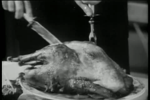 Close-up of hands cutting chicken with knife and carving fork Stock Footage 11353153
