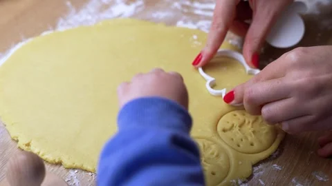 Close-up of Hands Cutting Cookie Dough with Biscuit Cutter Stock Footage 324483371