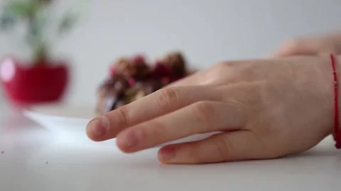 Close-up of hands cutting an Easter cake topped with chocolate glaze, walnuts, a Stock Footage 305295081