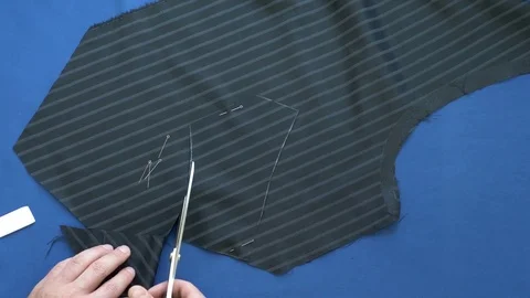 Close-up of hands cutting fabric Stock Footage 78122572