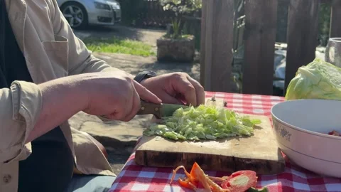 Close Up of Hands Cutting Fresh Red Vegetables on Wooden Board Stock Footage 333523566